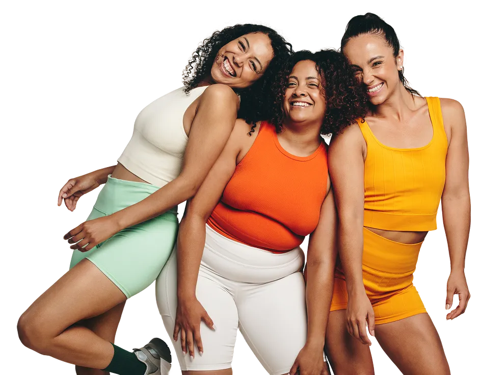 Three smiling women in activewear